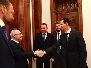 Chairman of the Committee on Issues of Public Associations and Religious Organizations Sergei Gavrilov and President of Syria Bashar Al-Assad