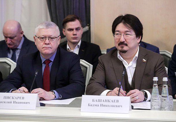 Chairman of the Committee on Security and Corruption Control Vasily Piskarev and Chairman of the Committee on Health Protection Badma Bashankaev